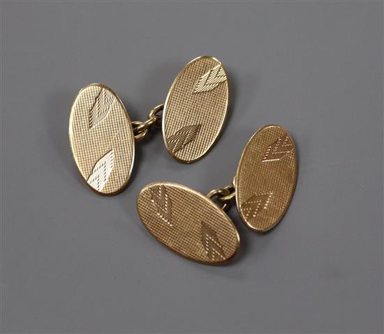 A pair of 9ct. gold oval disc cufflinks, 7 grams.